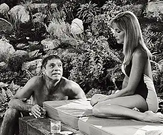 Burt Lancaster en Janice Rule in The Swimmer