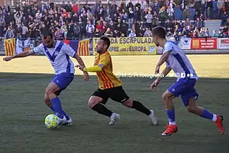 Duel between players of CE Europa and UE Sant Andreu