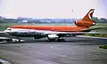 McDonnell Douglas DC-10-30 in overgangskleurenschema van CP Air op Luchthaven Schiphol in 1988