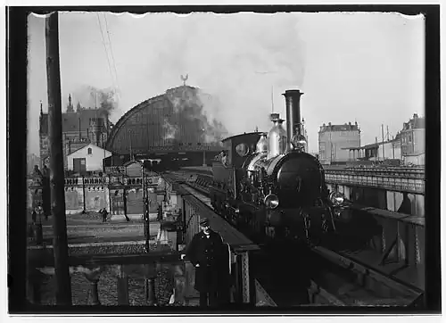 Spoorviaduct over Oostertoegang en Oostelijke Doorvaart; 1895.