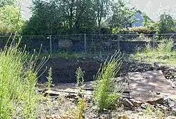 De oude schacht tijdens het opvullen in 2019