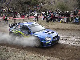 Chris Atkinson in een Subaru Impreza WRC bij de Rally van Argentinië 2005