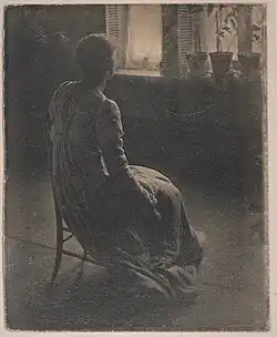 Woman seen from behind, ca 1905