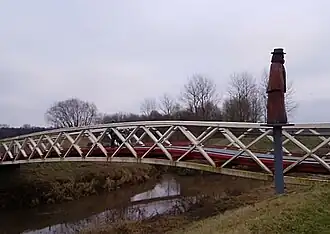 Damiaanstandbeeld aan Damiaanbrug over Dijle op de grens tussen Haacht en Tremelo
