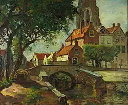 Stadsgezicht met toren en stenen bruggetje over gracht te Goedereede