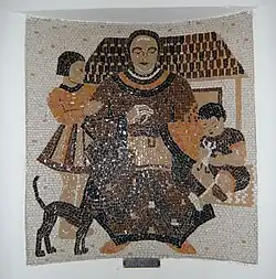 Mozaïek ter herdenking van de uitbreiding van 1935, met de "ideale huisvrouw" met twee kinderen, een huis en een kat, gemaakt door glaskunstenaar Femmy Schilt-Geesink.