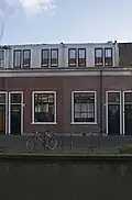 Woonhuis in 1863 gebouwd als arbeiderswoning in het rijtje van Rietveld 175-187. Gebouwd in sobere traditioneel classicistische vormen. Verbouwd onder meer in 1930.