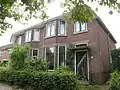 Helft van bouwblok met twee woningen