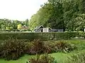 Nijenhuis, tuinmuur met druivenkas