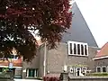 Doopsgezinde kerk (vermaning)(nr 55) met voormalige kosterswoning (nr 53),