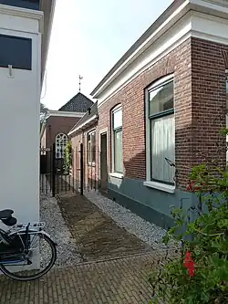 Ingang naar de vermaning vanaf de Herestraat