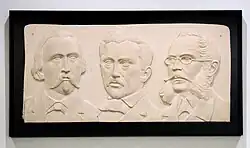 reliëf met de portretten van Dicks, Michel Rodange en Michel Lentz, Maison Servais, Mersch