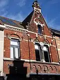 Eclectisch winkelhuis, gedateerd 1892