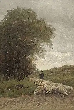 Herder met schapen op een bospad