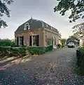 Rhijnestein: vrijstaande tuinmanswoning tussen trianon en boomgaard gelegen