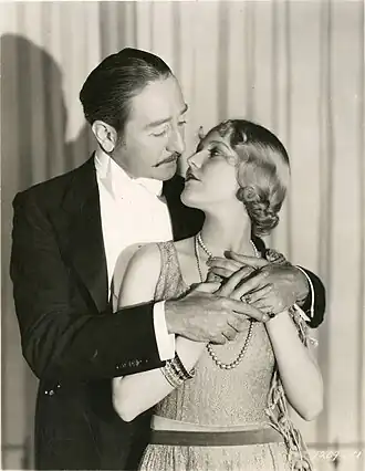 "Sophistication, every moment of it. Adolphe Menjou, the suave screen lover, illustrates the very adult way of showing love for Miriam Seegar, the famous English actress who supports him in his first dialogue picture, 'Fashions in Love.'"