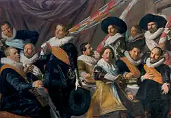 "Feestmaal Officieren van de St. Jorisschutterij, Haarlem, 1627" (c.1626-1627) Frans Hals Museum;Lieutenant Jacob Pietersz Olycan als zittende centrale figuur.