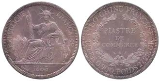 Een zilveren munt van 1 piastre uit 1885.