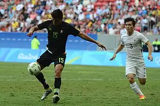 Gutiérrez (links) in actie op de Olympische Spelen tegen Zuid-Korea