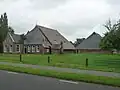 Kop-rompboerderij in ambachtelijk-traditionele bouwtrant in roodbruine baksteen