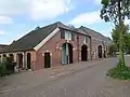 Boerderij met twee aangebouwde bijschuren