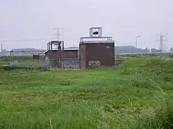 Gemaal Oude Pekela met kunstobject De Praam van Peter Huijgen