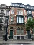 Burgerhuis met achterhuis, gedateerd 1889