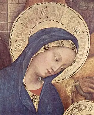 Detail van De aanbidding der wijzen (1423), Uffizi, Florence. De halo bevat pseudo-Arabisch schrift met rozetten als interpunctie, zoals op Mamlukse borden.[1]