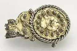 Germaanse schijffibula, opgegraven in Nigrum Pullum.