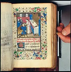 f52r: Opdrachtgever die de communie ontvangt (bij de bijzondere gebeden)