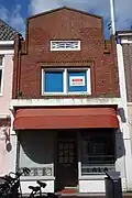 Winkelwoonhuis met expressionistisch metselwerkdecoraties
