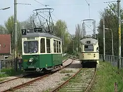 Tweeassige motorwagen 206 op de Electrische Museumtramlijn Amsterdam te Amstelveen. Deze tram is inmiddels teruggekeerd in Graz. Rechts is PCC-car HTM 1024.