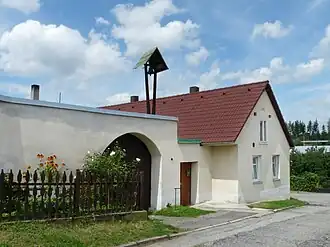 Huis met klok in Heřmaň