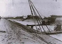 Werkzaamheden bij Haghorst. Vrnl een heibok, een keerdam, een excavateur, een stoomtrein, een ophaalbrug en een tweede graafmachine. Foto 1922.