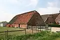 Schuur in Ambachtelijk-traditionele bouwtrant, als onderdeel van de boerderij
