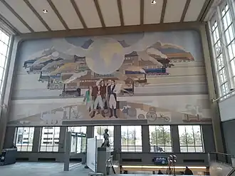 Muurschildering van Peter Alma in de stationshal aan de oostzijde: Het resultaat van technische ontwikkeling, 5 november 2021.