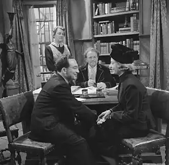 Lerou (staand links) in het tv-spel Hij zit aan de smeltkroes (VPRO, 1962)