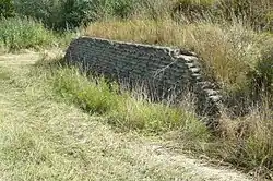 De zandzakken langs de N225