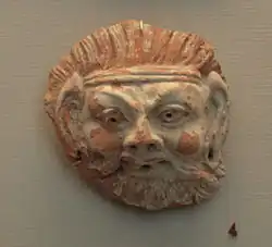 Grotesk gezicht, stucwerk, 7e-8e eeuw
