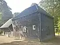 Houten schuur bij huis "Bosbeek"