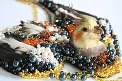 Vogelcollier Valkparkiet, privécollectie van Sara Visbeek en Jeroen Redel.