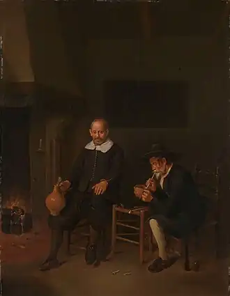 Interieur met twee mannen bij het vuur