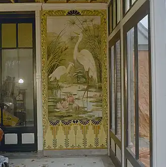 Een van de tegeltableaus in de serre