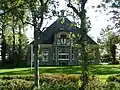 Stelpboerderij in ambachtelijk-traditionele bouwstijl met art-nouveau-invloeden