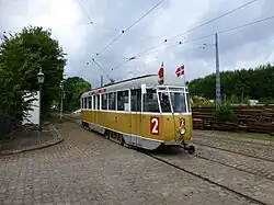 Gestroomlijnde vierassige motorwagen 701 als lijn 2; 31 augustus 2013.
