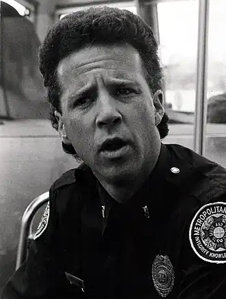 Lance Kinsey in zijn rol als Proctor in Police Academy 4 (1987)