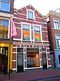 Winkel met bovenwoning