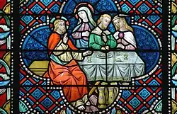 Glas-in-loodraam uit de beginperiode: "Het leven van Christus - De bruiloft te Kanaä", in 1879 gemaakt door glazenier Jean-Baptiste Bethune.