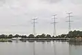 Drie kruisingsmasten; Maasoversteek bij Linne in Nederland.