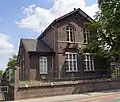 Voormalig parochiehuis, later schoolgebouw, in eclectische stijl